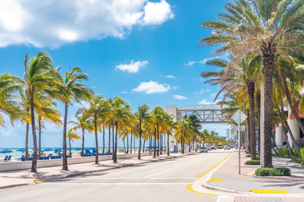 Fort Lauderdale beach with palm trees - Are Short-Term Rentals a Good Investment in Florida? - DG Pinnacle Commercial - Miami Mortgage Lender