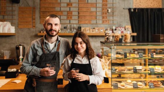 Young couple of independent workers in their own coffee-shop | Mortgage Loans Your Self-Employed Customers | DG Pinnacle Commercial - Miami Mortgage Lender
