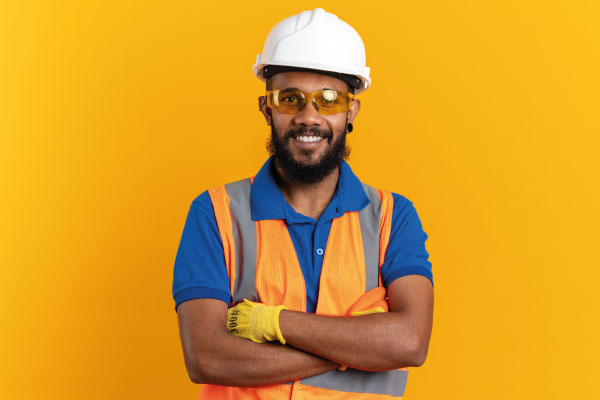 Young afroamerican independent contractor with helmet smiling | Mortgage Loans Your Self-Employed Customers | DG Pinnacle Commercial - Miami Mortgage Lender