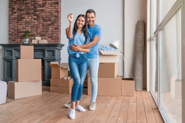 Happy couple moving to their new house | Who is eligible for Non-QM Loans | DG Pinnacle Commercial - Miami Mortgage Lender